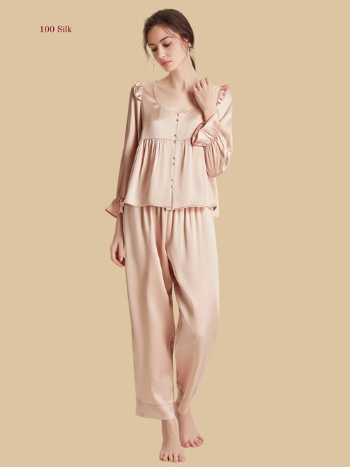 Pink 16.5mm peplum silk set front view with ruffle shoulders and full-length pants