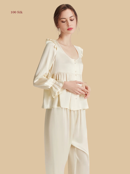 Off-white 16.5mm peplum silk set front view with rounded neckline and shoulder ruffle detail