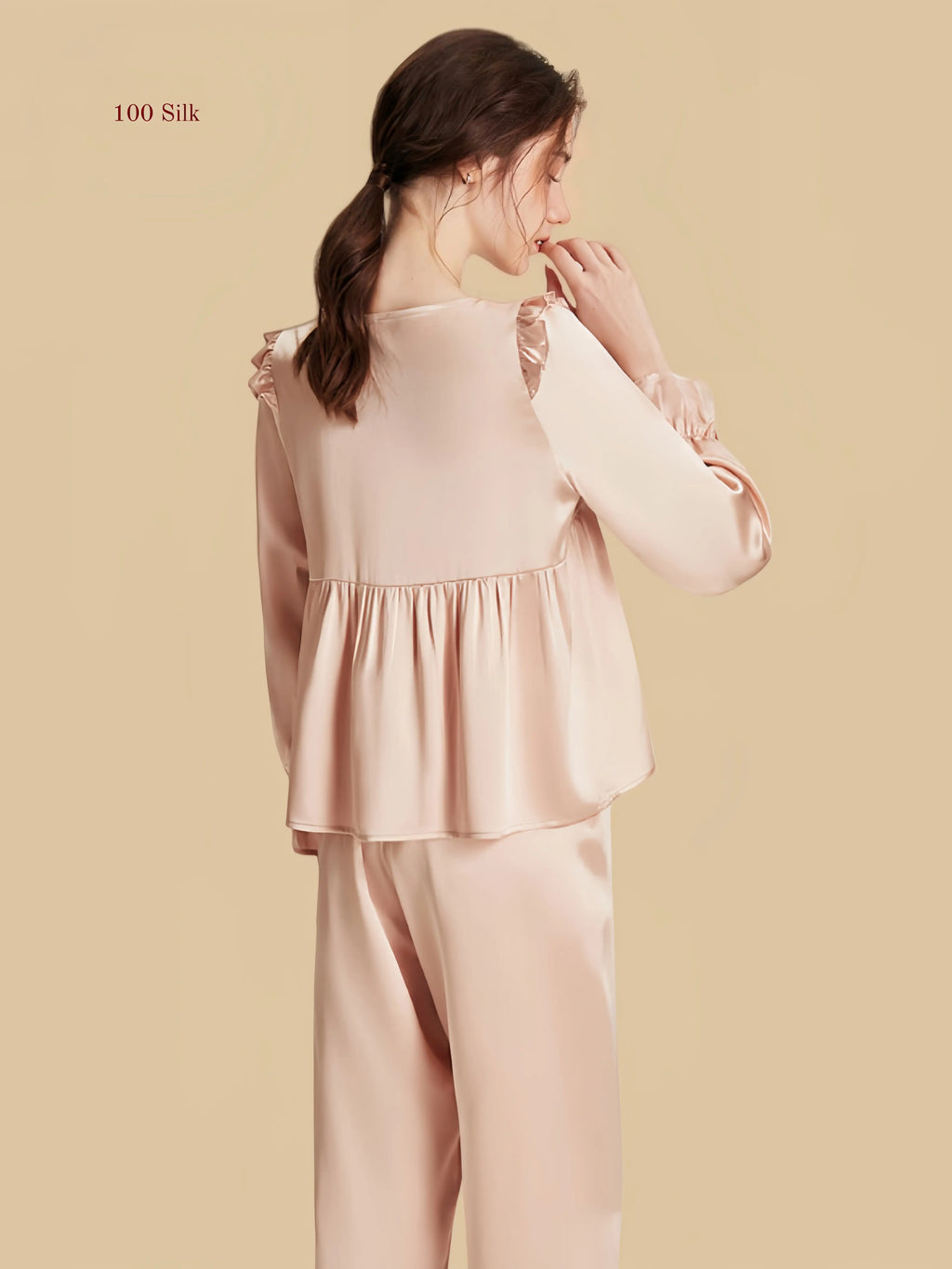 Pink 16.5mm peplum silk set back view with gathered waist seam and long pants