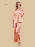 Pink 19mm fluid silk sleep set front view with lace-appliqué neckline and straight trousers