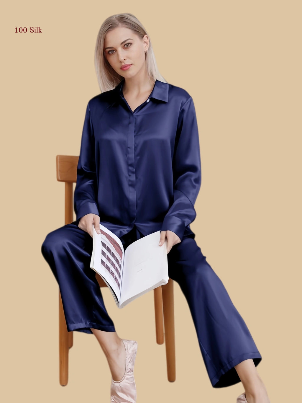 Navy blue 19mm minimal pajama set seated view with smooth shirt-style top and straight pants