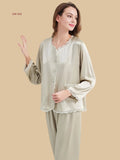 Sage Champagne 19mm round-neck silk set front view with scalloped neckline, patch pockets, and full-length pants