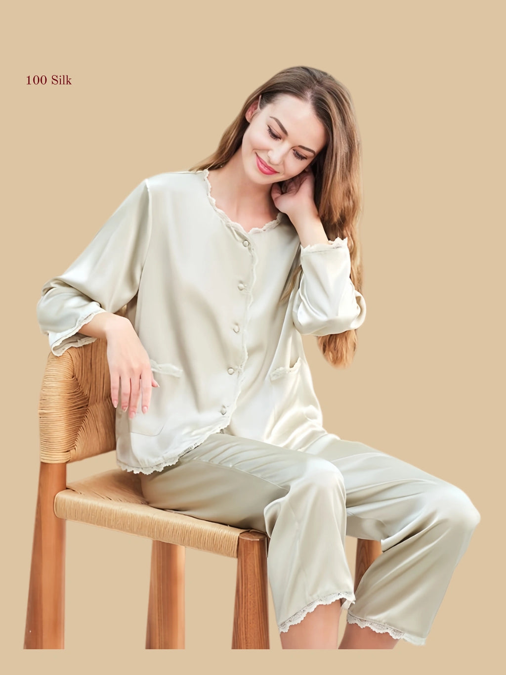 Detail view of 19mm round-neck silk set showing scalloped neckline, patch pocket trim, cuff edge, and pant hem finish
