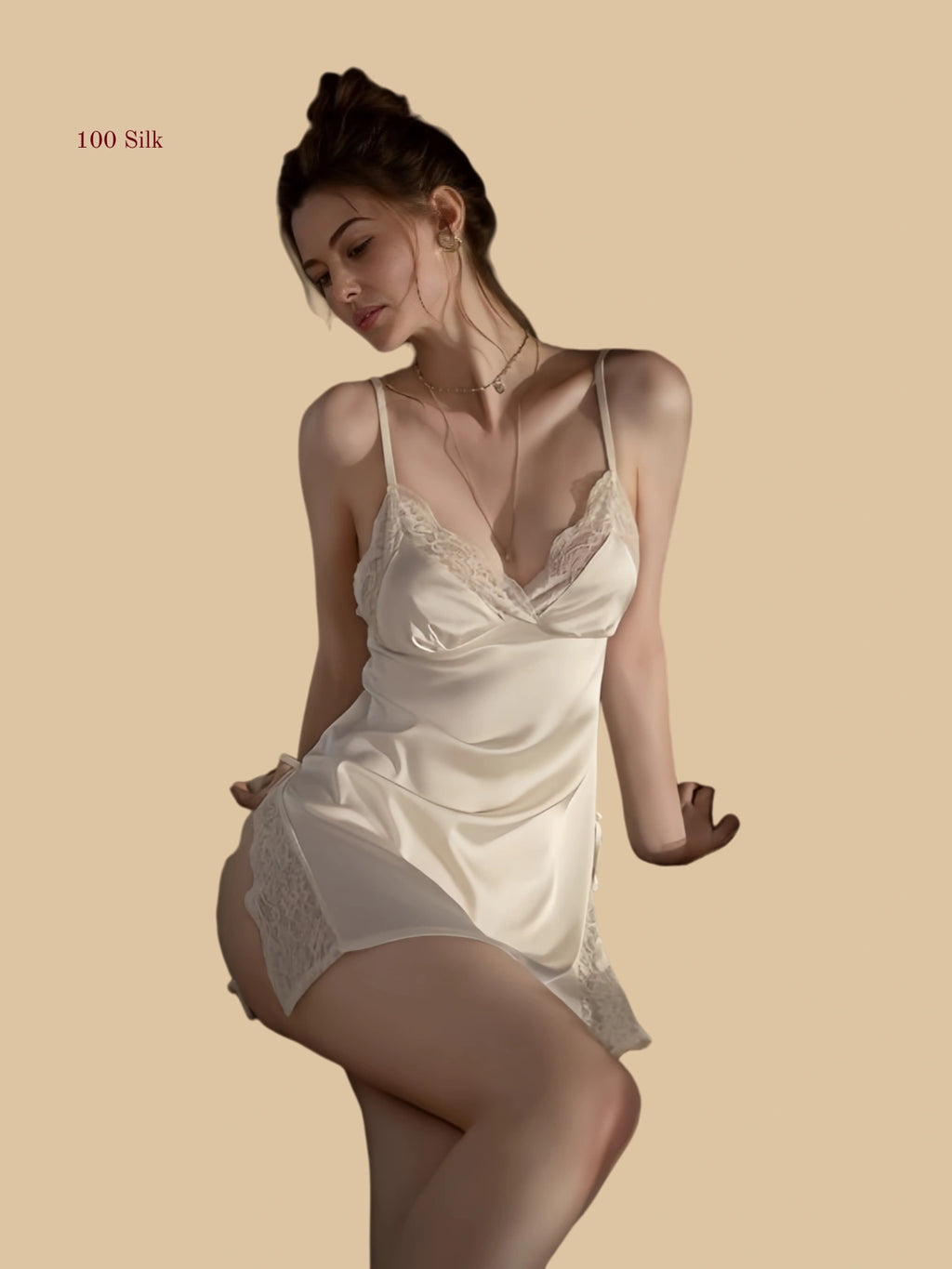 Front view of 19mm silk slip dress with lace panel and side slit in white.