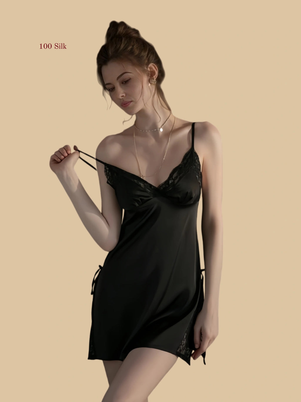 Front view of 19mm silk slip dress with lace panel and side slit in black.