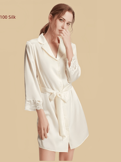 Off-white 16mm silk sleepshirt front view with lace cuffs, lace-trim pocket, and button front