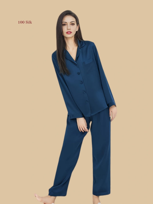 Royal blue 16mm button-up pajamas seated view with smooth shirt front and full-length pants