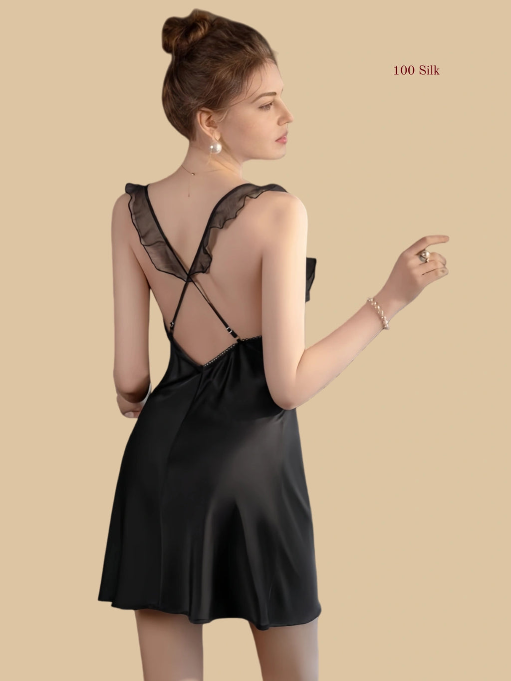Back view of silk mini slip dress with cross-back straps