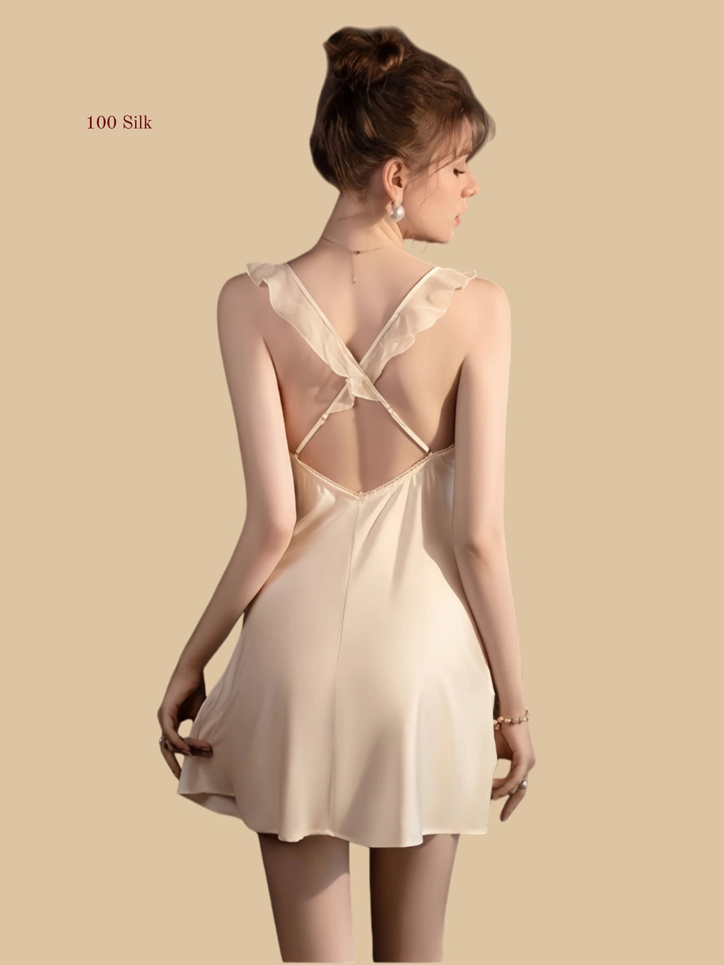 Back view of silk mini slip dress with cross-back straps