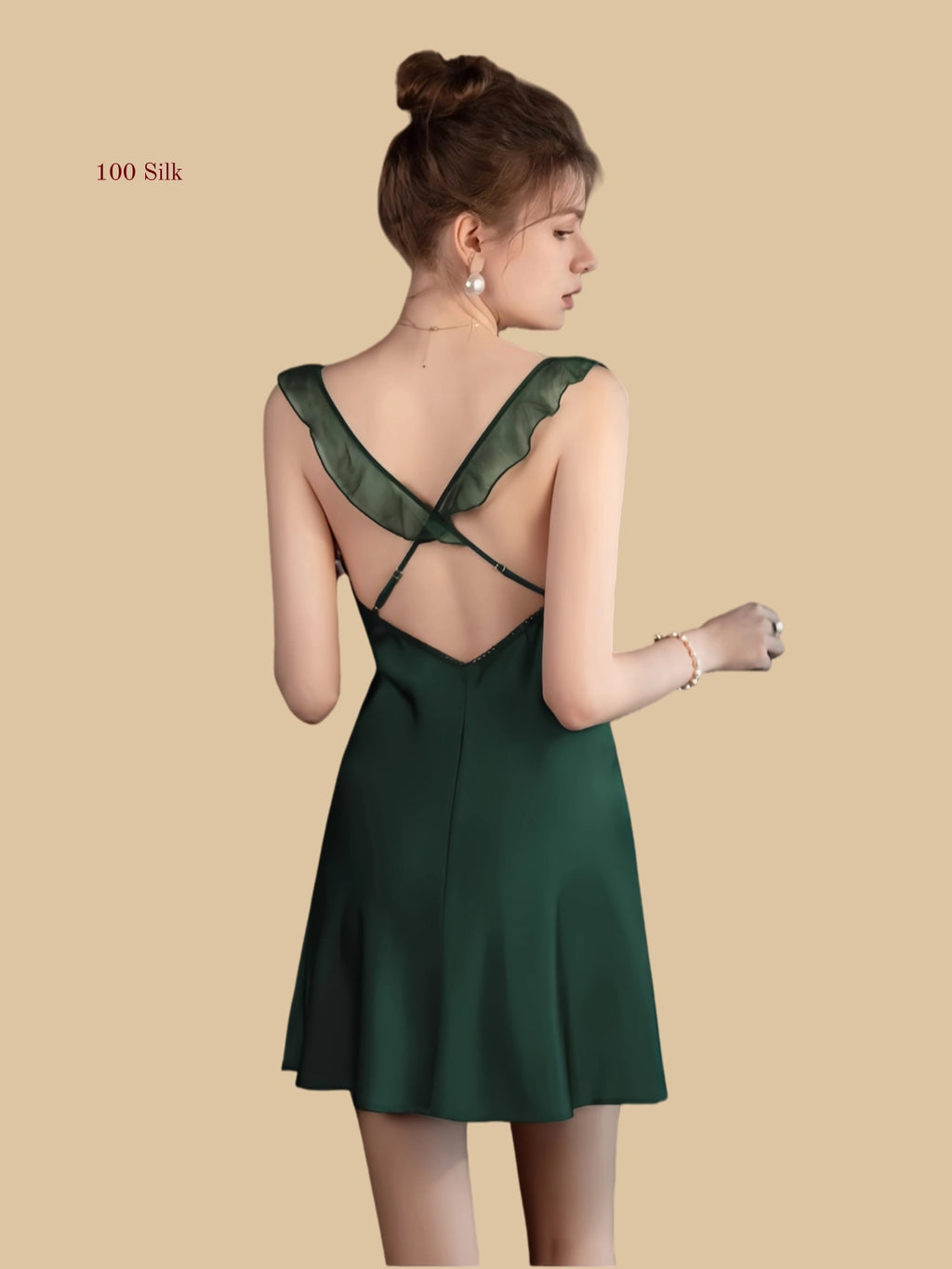 Back view of silk mini slip dress with cross-back straps