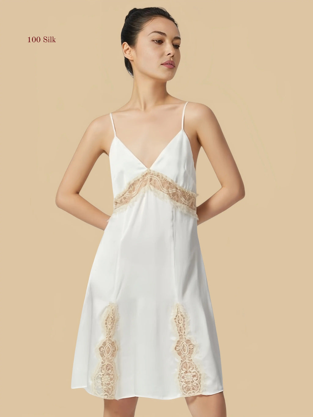 Front view of a white 19mm mulberry silk nightgown with exquisite eyelash lace detailing on the bust and hem.