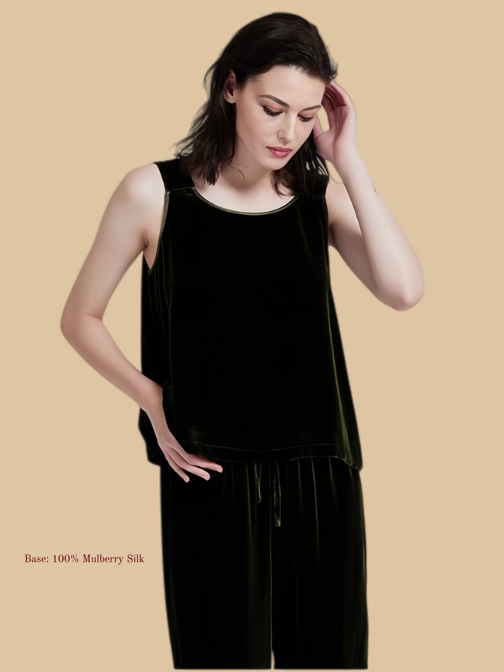 Dark green velvet vest and pants set front view with sleeveless top and drawstring trousers