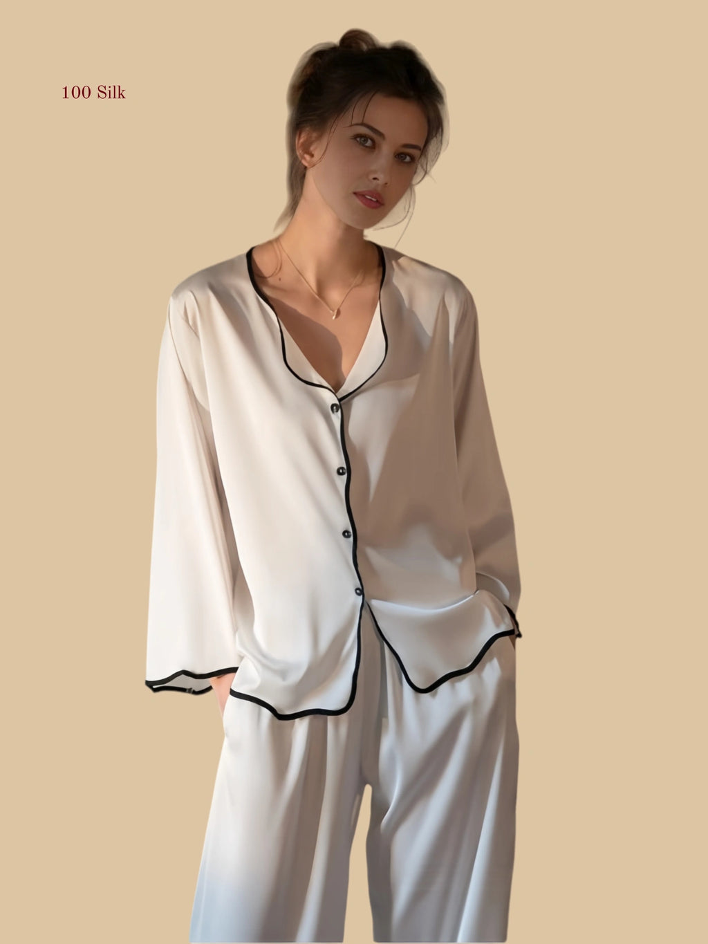 White 19mm soft-neck silk set front view with black contrast wave trim and relaxed trousers