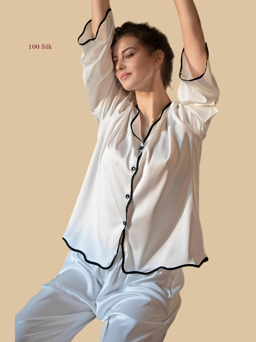 White 19mm soft-neck silk set close view with collarless V neckline and flowing top