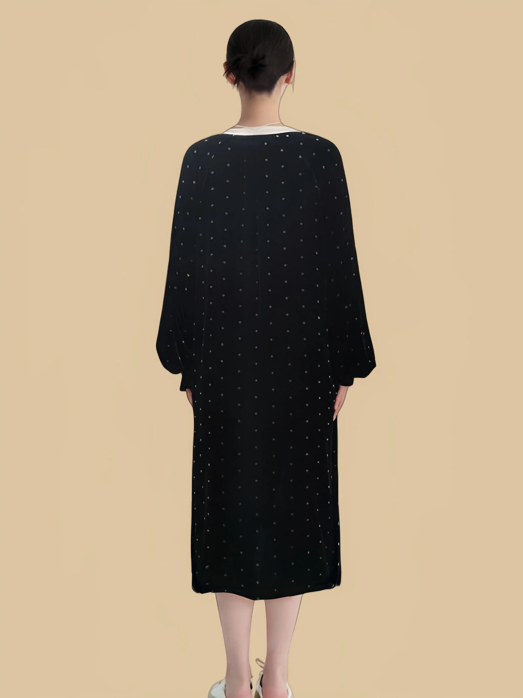 Black tassel-tie velvet dress back view with loose midi silhouette