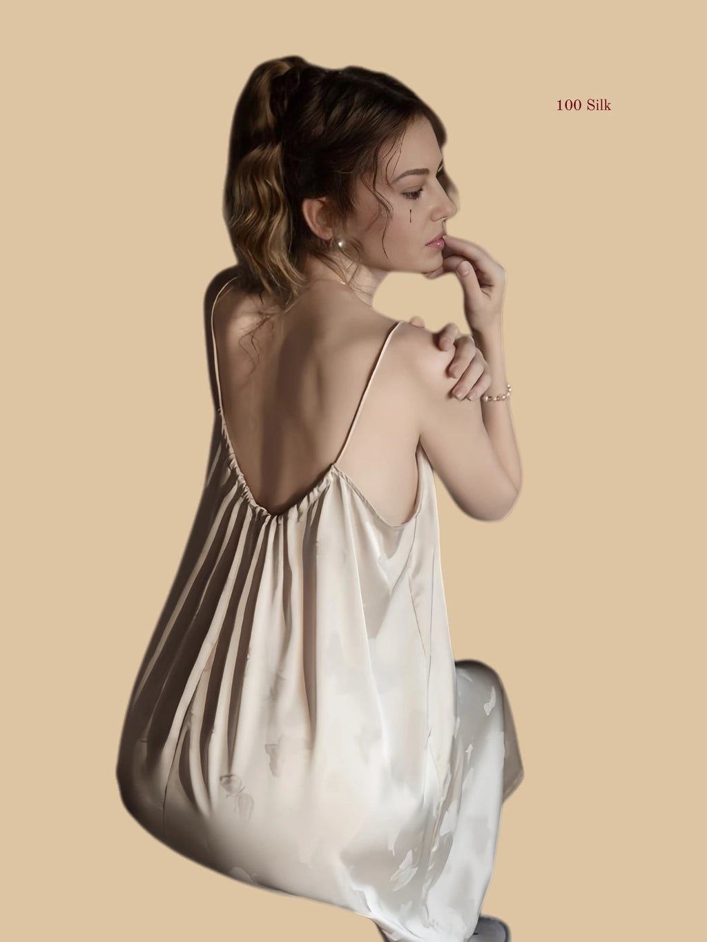 Back view of silk nightgown with low gathered back and flowing silhouette