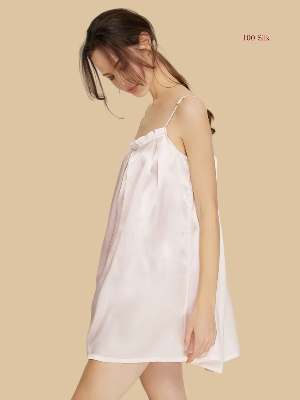 Front view of a 16mm Light pink mulberry silk babydoll nightgown with delicate pleating and a loose A-line silhouette.