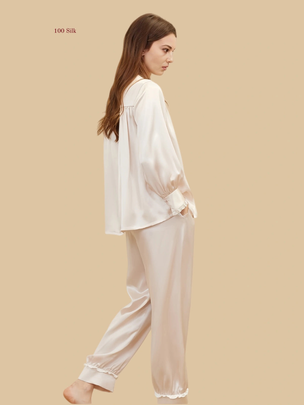 pink 19mm lantern-sleeve silk set back view with relaxed top and frill-trim pant hems