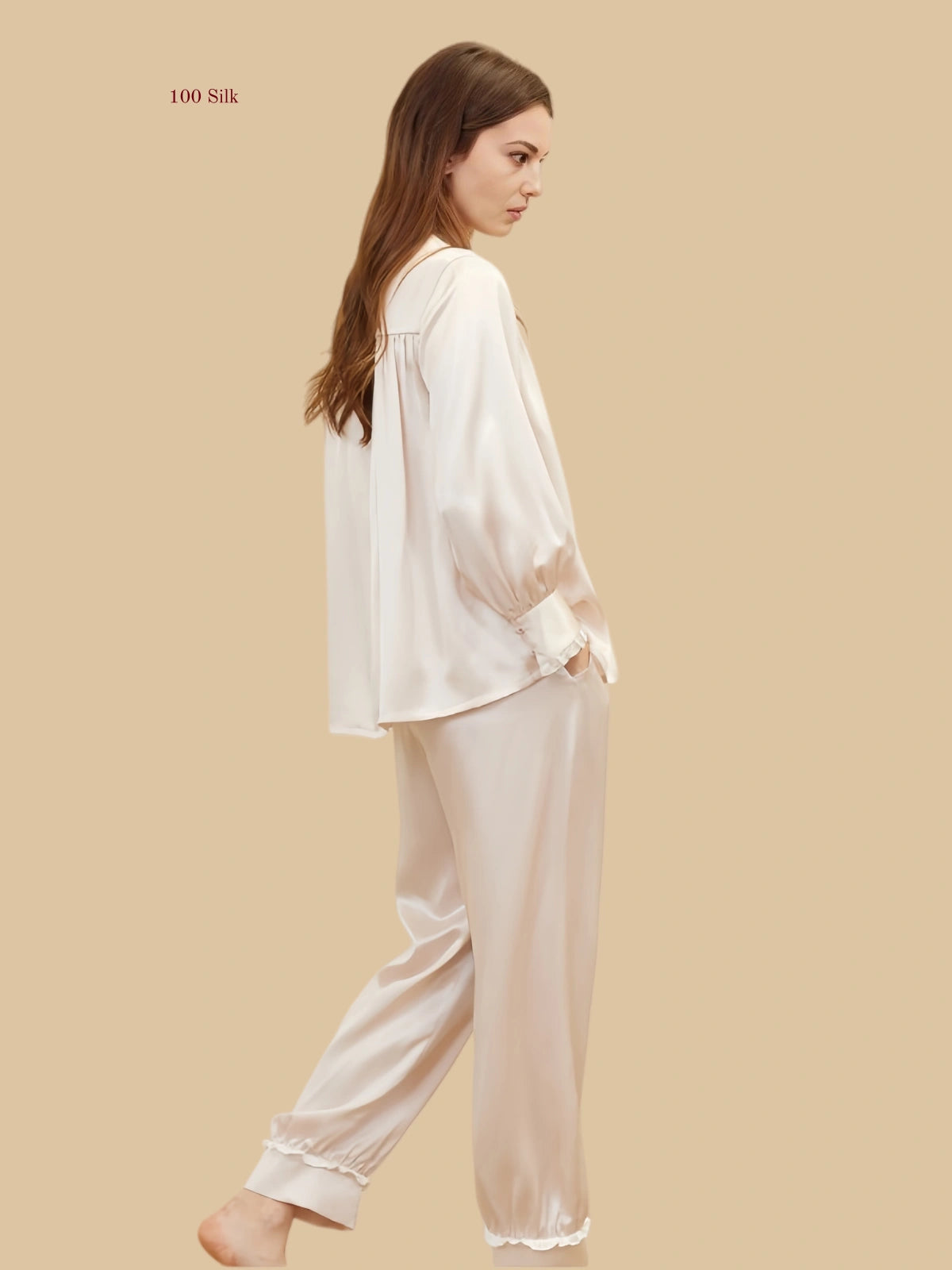 pink 19mm lantern-sleeve silk set back view with relaxed top and frill-trim pant hems