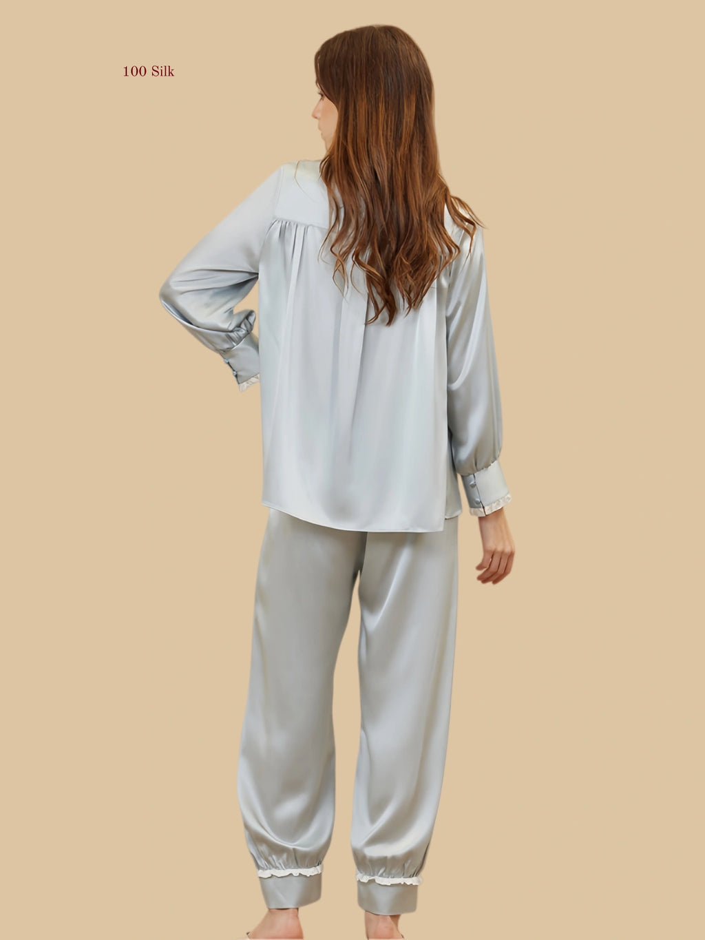 Mint green 19mm lantern-sleeve silk set back view with relaxed top and frill-trim pant hems