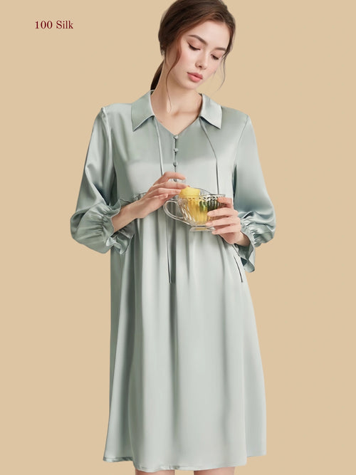 Blue 16mm silk lounge dress front view with soft collar, empire seam, and shirred lantern sleeves