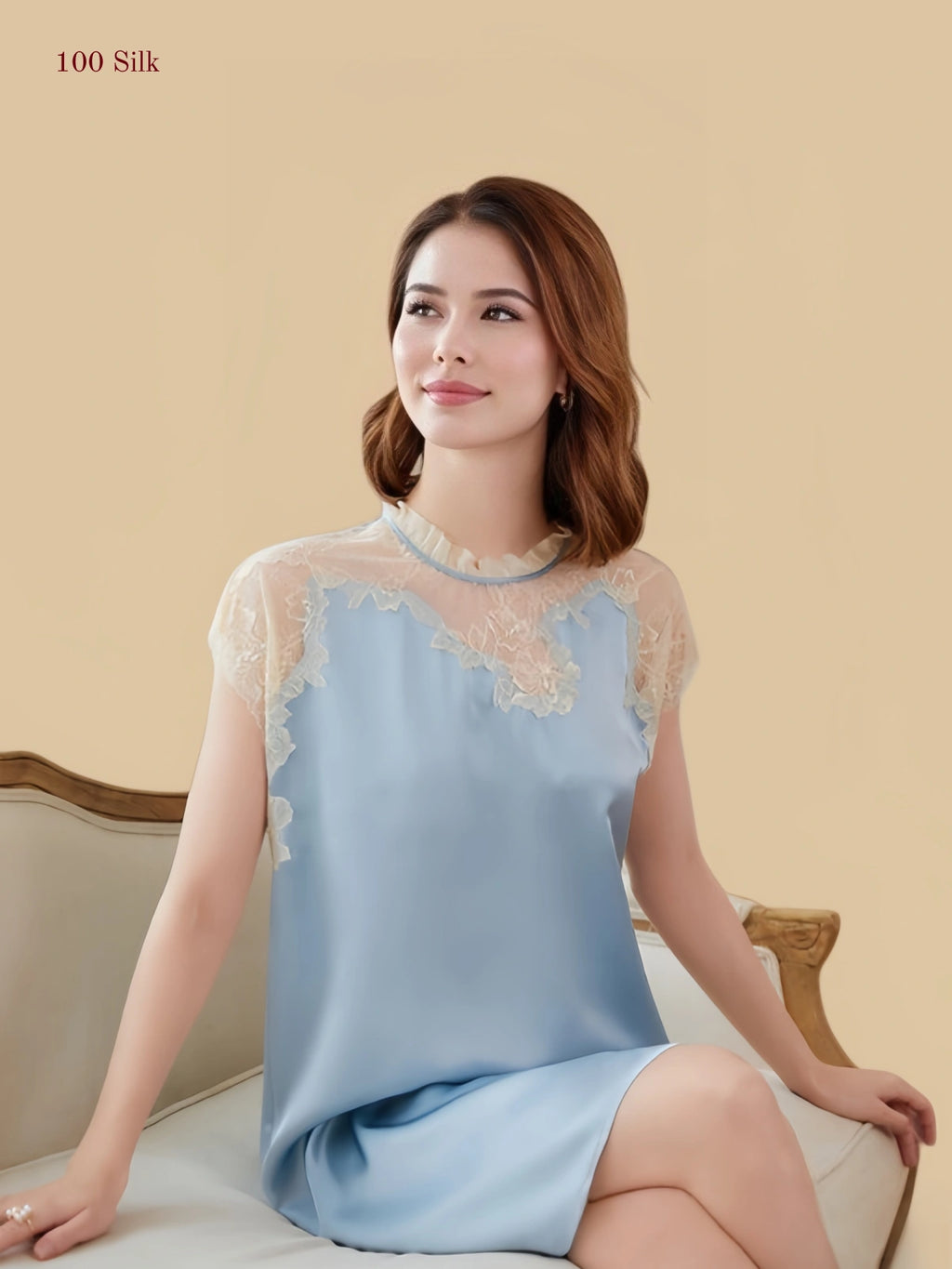 Blue 19mm silk sleep dress seated view with lace neckline and short loose silhouette
