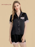 Agate Black 16 Momme silk shirt and shorts set front view with pink lace pocket and cuffs