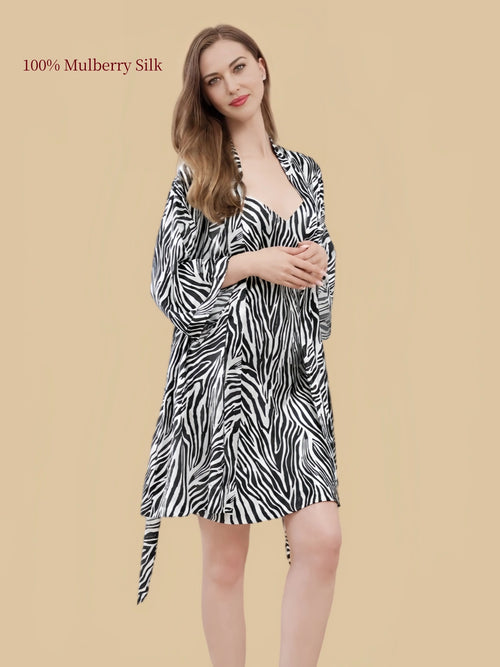 Black-and-white zebra print silk robe with a matching waist tie, relaxed wide sleeves and wrap-front design.