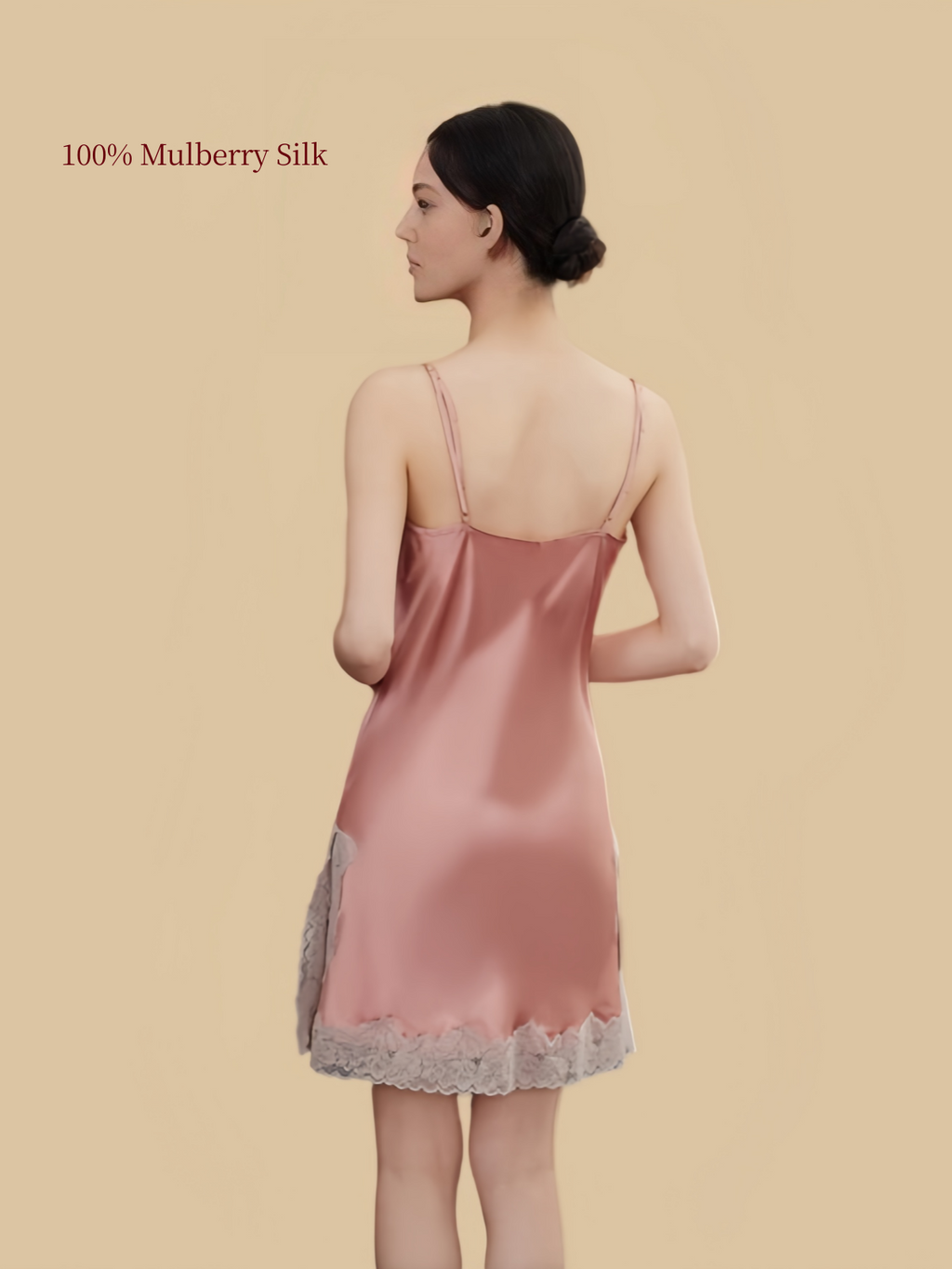 Back view of Dusty Pink silk slip dress showing adjustable shoulder straps, simple low back and ivory lace hem.