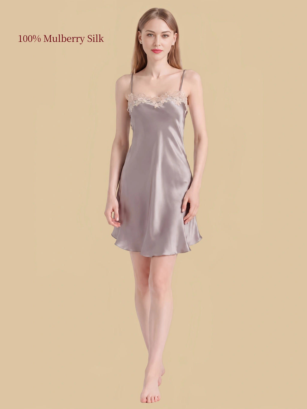 Front view of Gray silk cami nightdress with adjustable thin straps, ivory floral lace neckline and flared short hem.