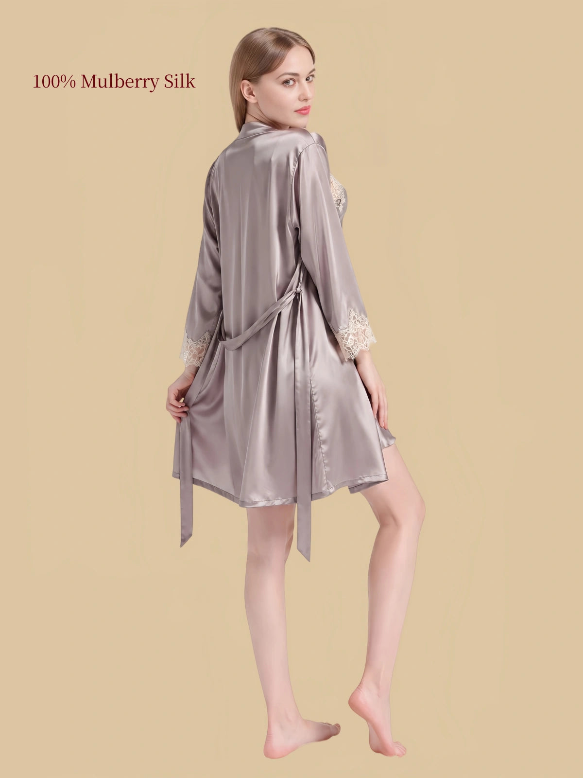 Back view of Gray silk dressing gown showing its flowing fabric, long sleeves and matching waist tie.