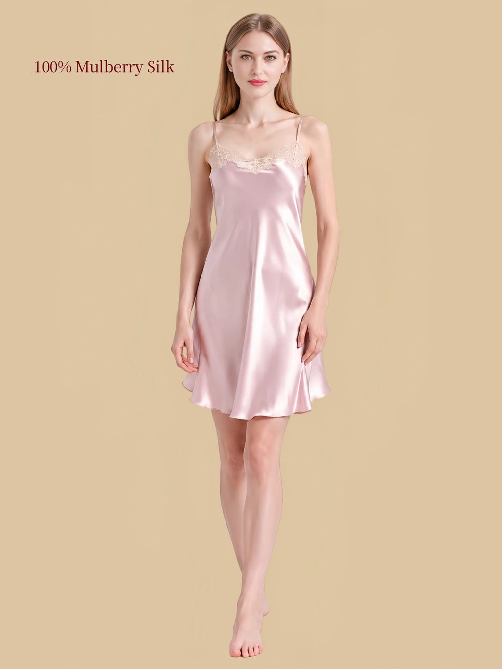 Front view of Pink silk cami nightdress showing light floral lace neckline, slender adjustable straps and fluid hem.