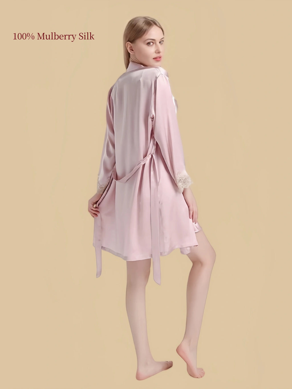 Rear three-quarter view of Pink silk robe with matching long waist belt and relaxed long-sleeve silhouette.