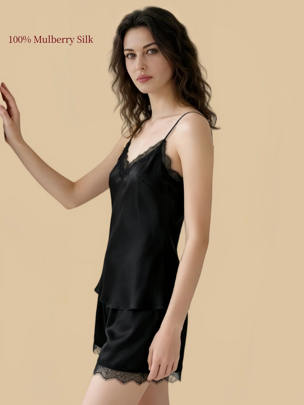 Side view of an Agate Black 19 Momme silk cami and shorts set with softly shaped silhouette