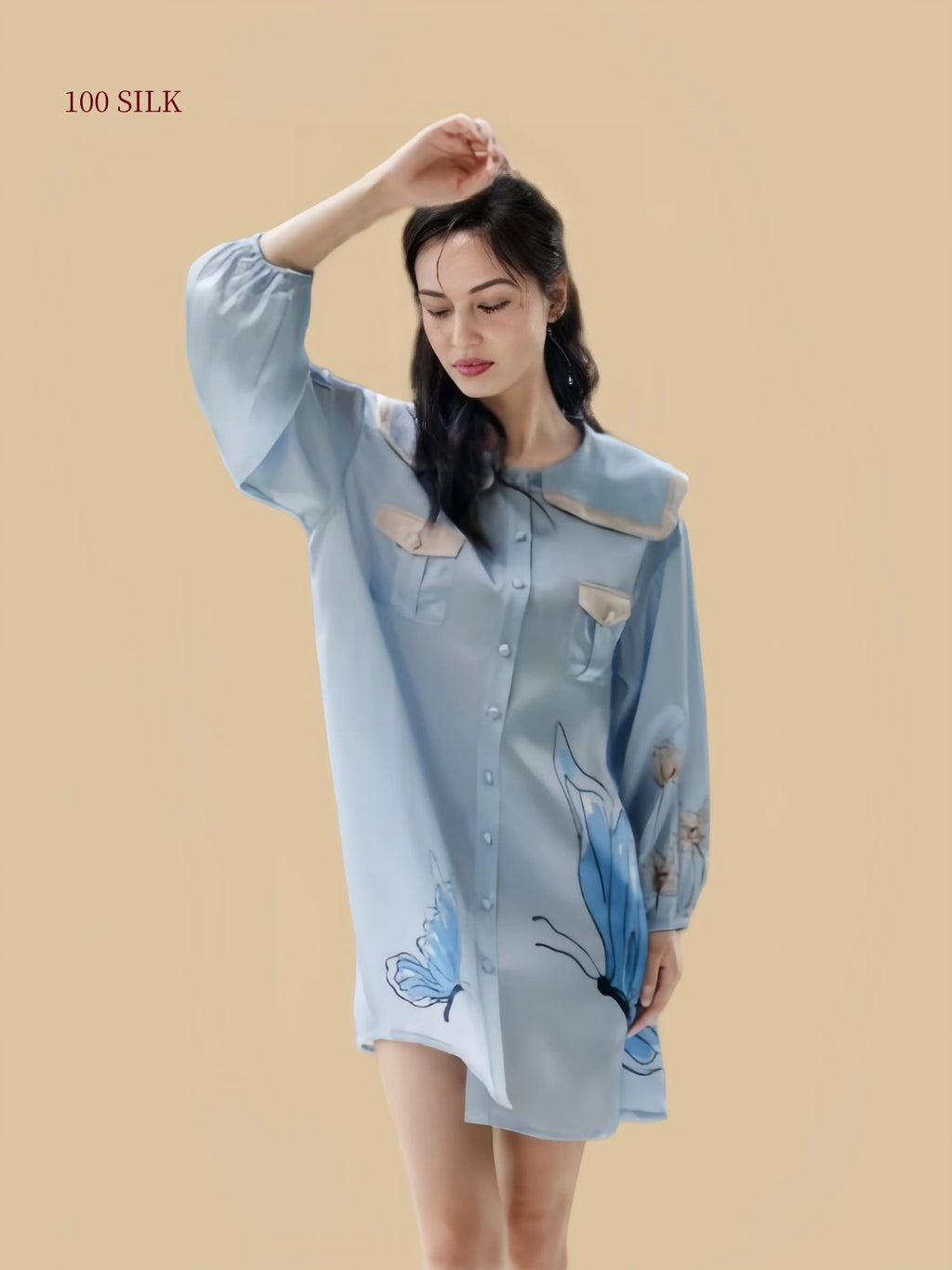 Front pose of a Dusty Blue 19 momme silk sleep dress with sailor collar, button front and butterfly print