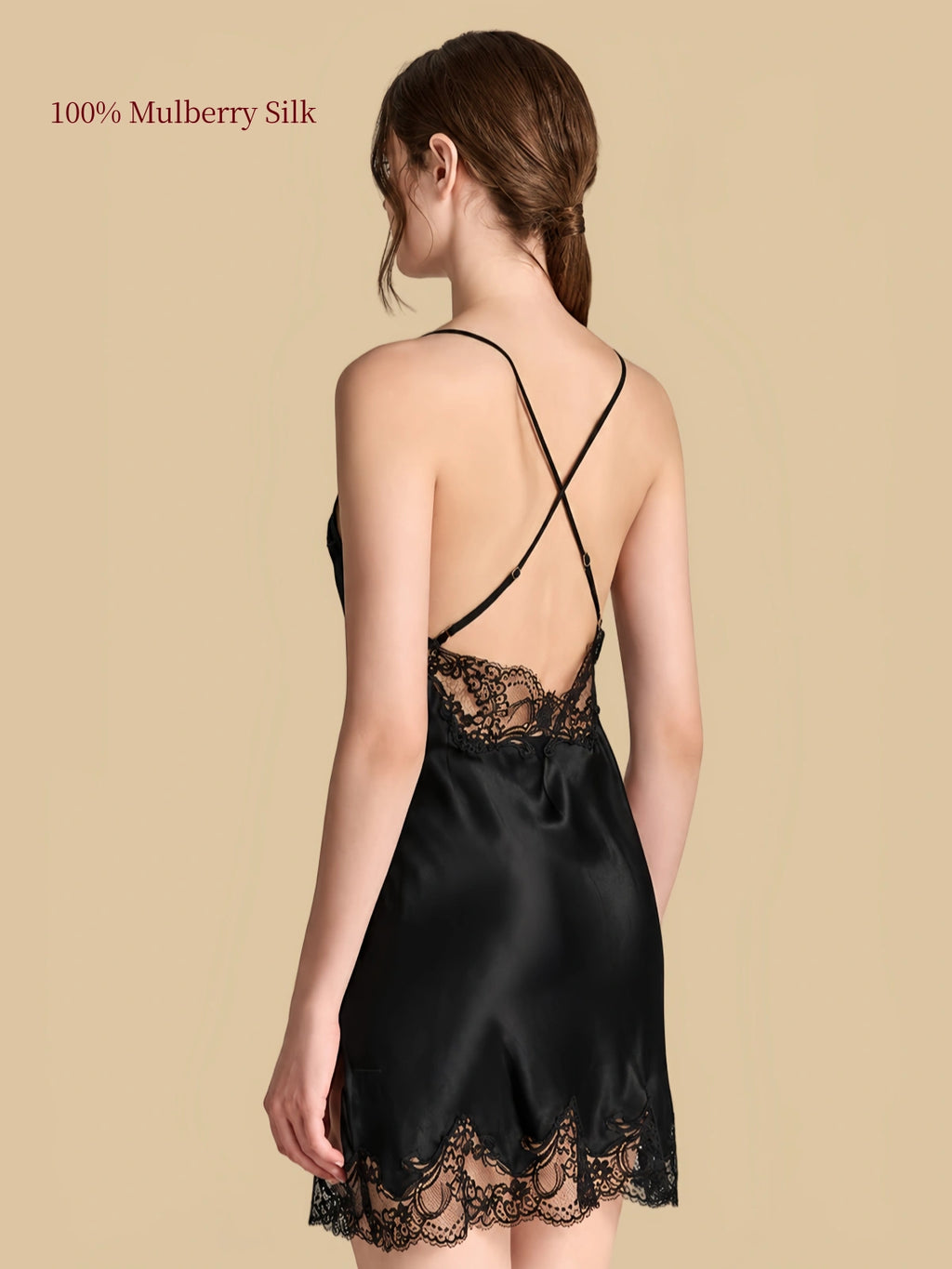 Back view of Black silk nightdress with crisscross adjustable straps, floral lace back panel and lace-trimmed hem.
