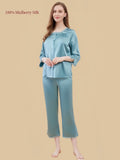Silkgala Peacock Green 19 Momme mulberry silk loungewear with a lace-trim square neckline, button-front top, three-quarter sleeves and calf-length pants.