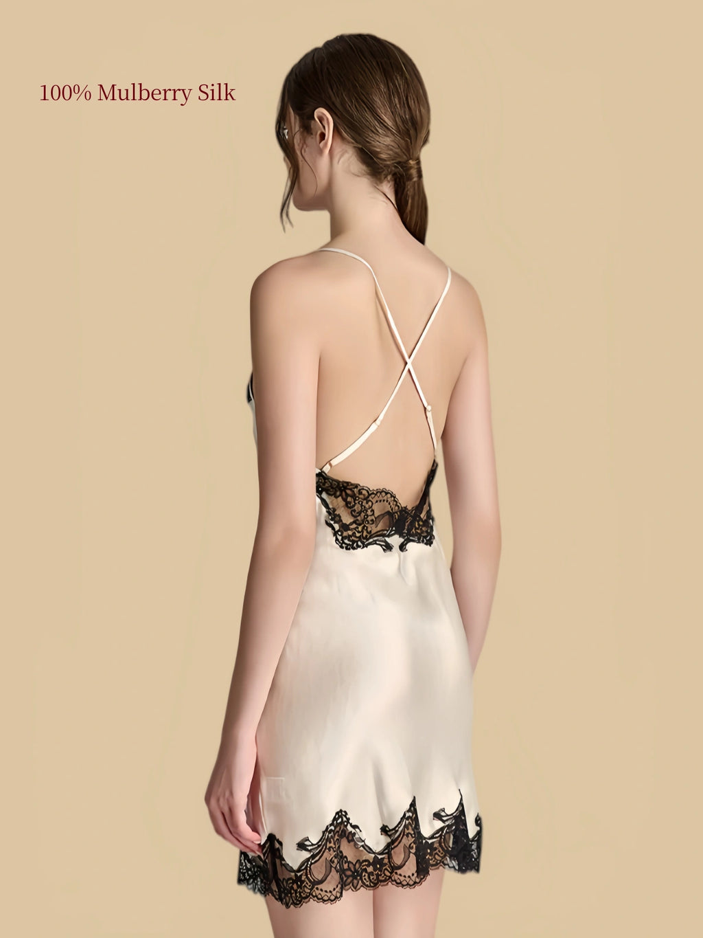 Back view of White silk nightdress with adjustable crisscross straps, black lace back panel and scalloped lace hem.
