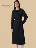 Silkgala black silk blend midi dress featuring a round neckline with gathered front detail, long sleeves, and defined waist belt.