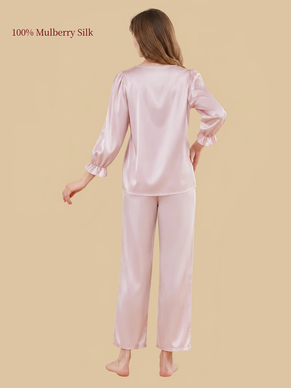 Back view of Silkgala Blush Pink silk pajamas showing the smooth satin-like finish, gently gathered sleeves and straight-leg pants.