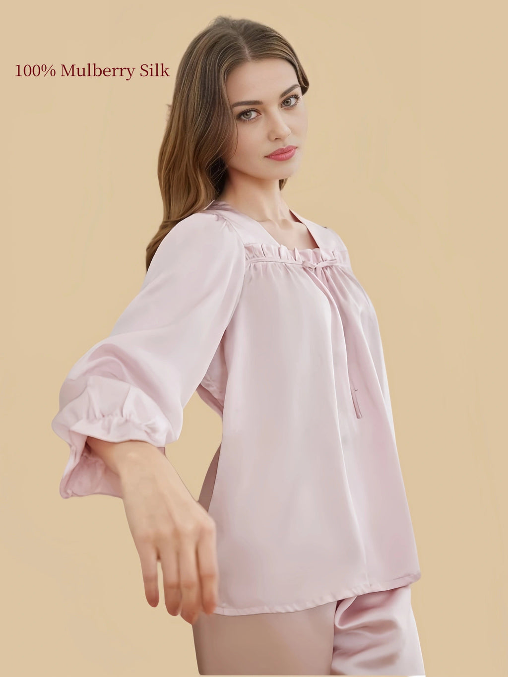 Close-up of Silkgala Blush Pink silk pajama top showing the ruched square neckline, decorative tie and gathered long sleeve.