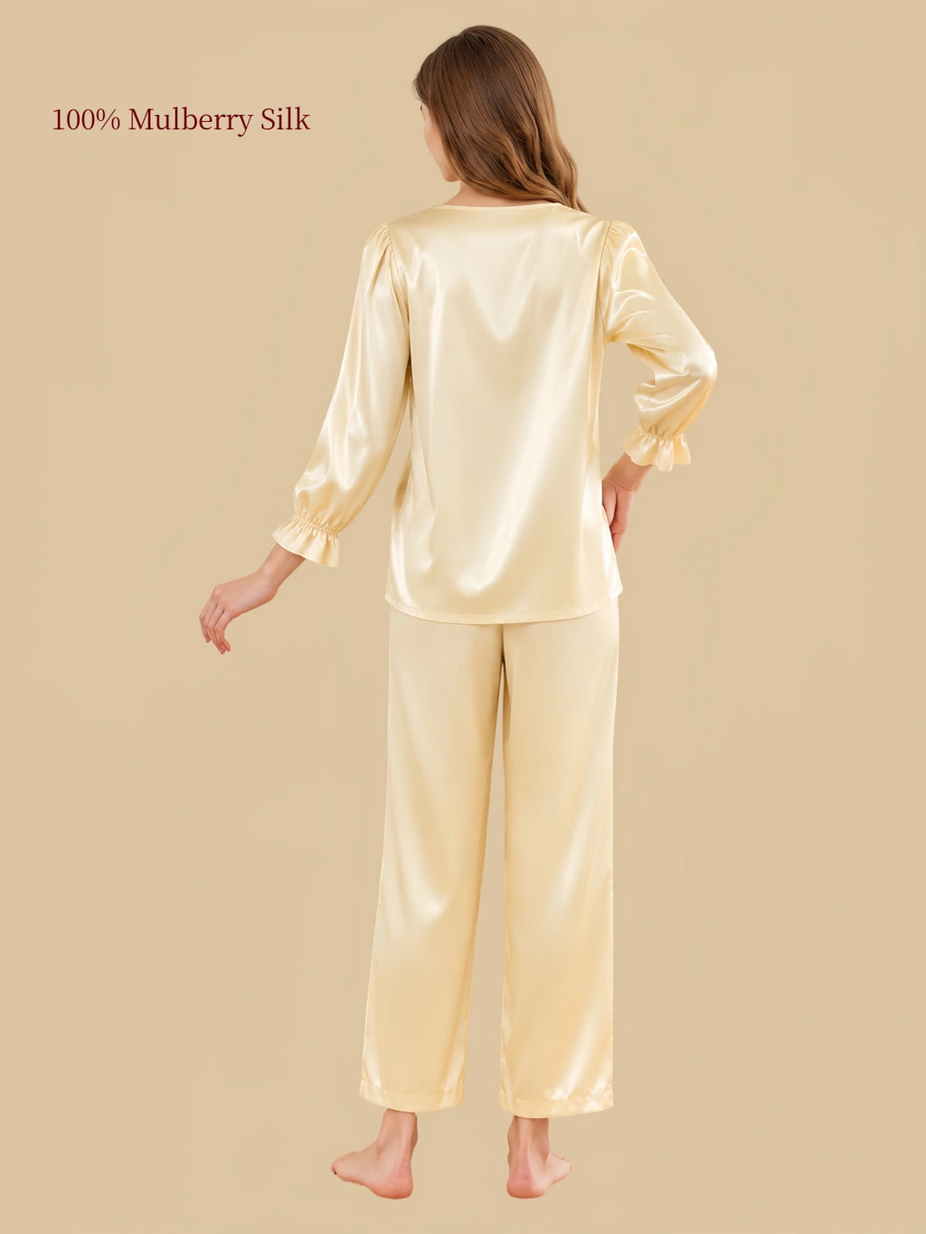 Back view of Silkgala Pale Champagne Yellow silk pajamas featuring a relaxed pullover silhouette and coordinating straight-leg pants.