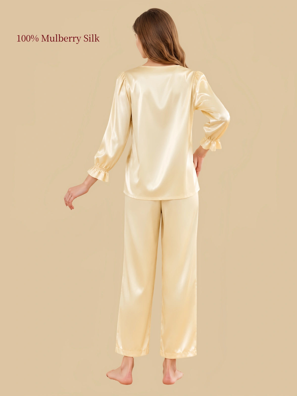 Back view of Silkgala Pale Champagne Yellow silk pajamas featuring a relaxed pullover silhouette and coordinating straight-leg pants.