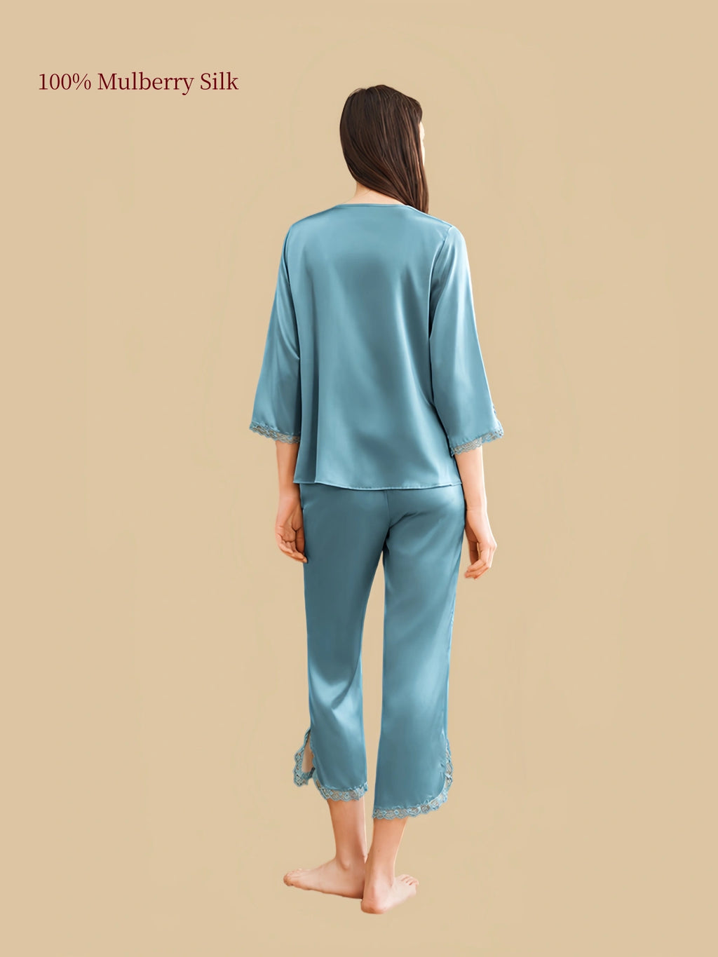 Back view of Silkgala Peacock Green silk pajama set showing a relaxed top, three-quarter sleeves with lace trim and matching calf-length pants