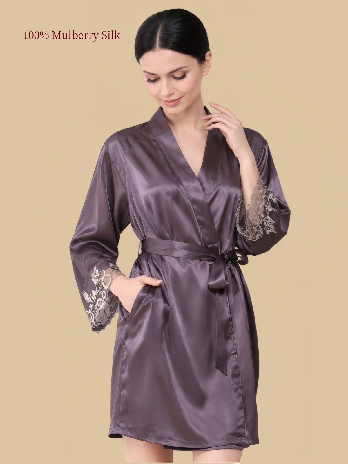 Front view of a purplish-grey silk robe with wrap neckline, matching waist belt, side pockets and lace cuffs.