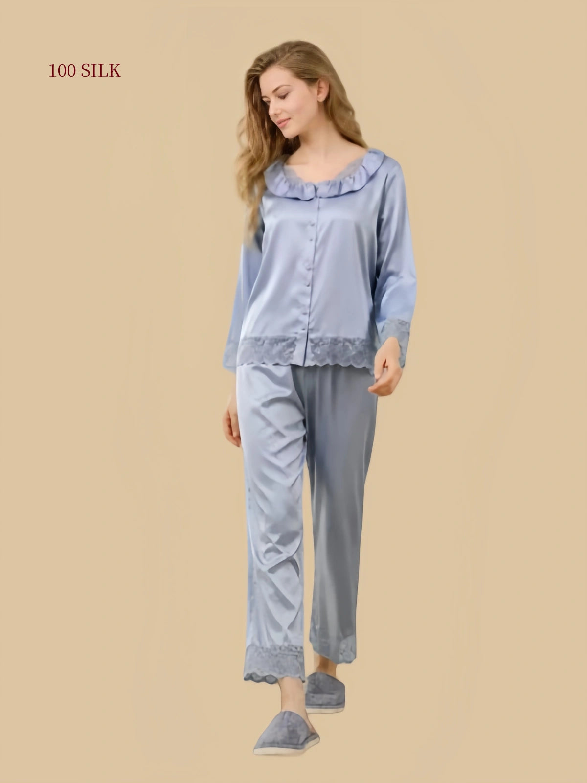 Three-quarter view of Silver Mist Blue mulberry silk pajamas with a button-front top and straight-leg pants