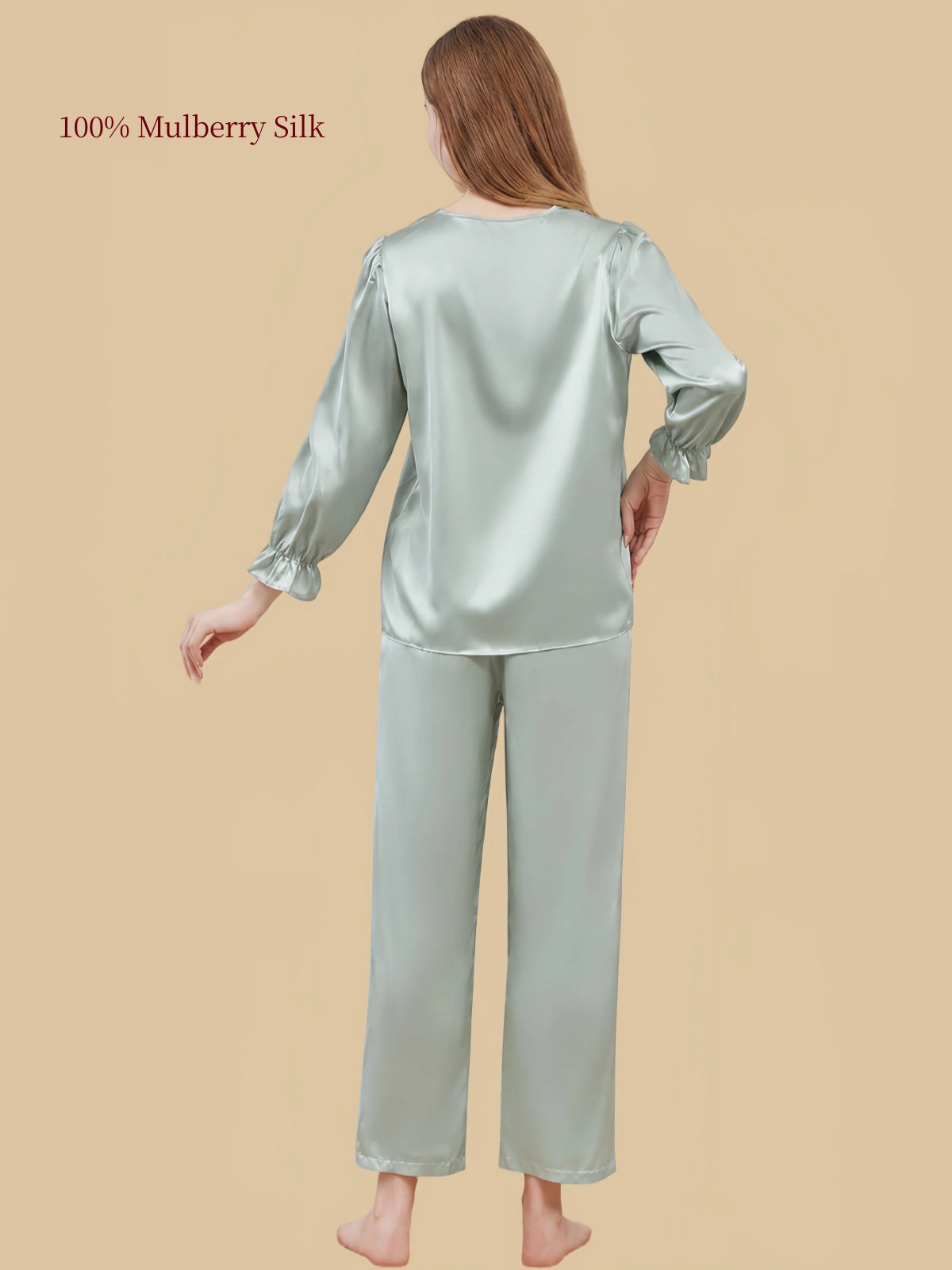 Rear view of Soft Sage Green silk sleepwear by Silkgala highlighting the loose-fitting top, softly gathered sleeves and matching pants.