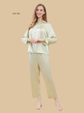 Green 19mm mulberry silk sleepwear set front view with soft ruffled neckline and romantic ruffle cuffs